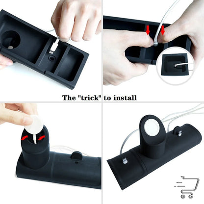 Black plastic cable management device with compartments for unique home gadgets