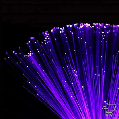 Bundle of illuminated purple fiber optic strands creating vibrant lighting magic